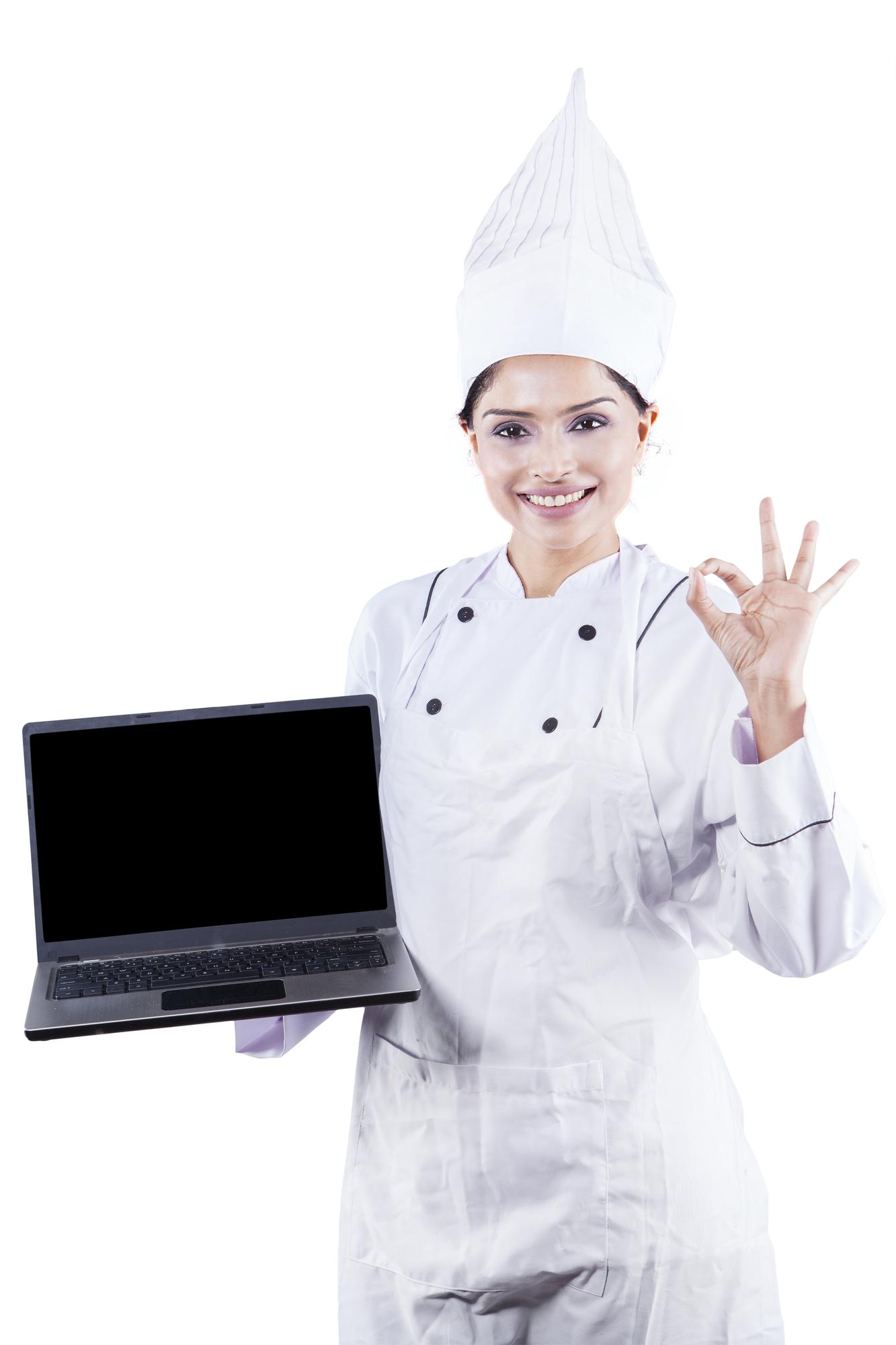 Chef teaching a student in a modern kitchen